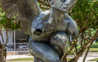 The statue "El Tiempo," which depicts a kneeling winged man